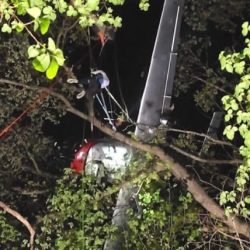 A rescue helicopter lifts a 79 kg