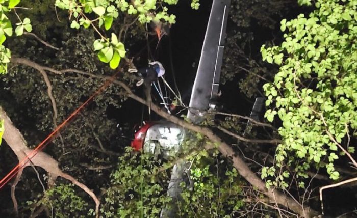 A rescue helicopter lifts a 79 kg