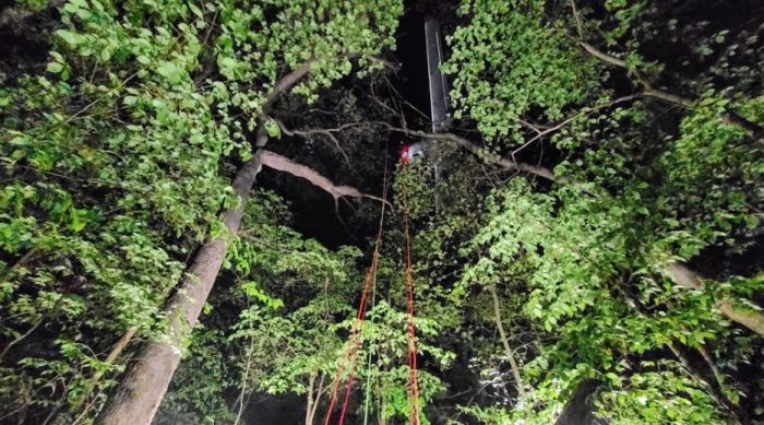 A rescue helicopter lifts a 79 kg